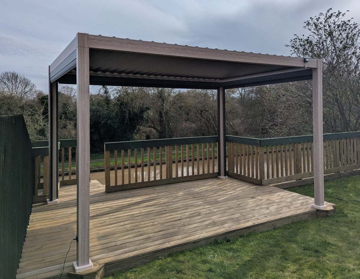 LuxShade™ 3×4m Oak Effect Aluminium Pergola with LEDs, Double-Layered Louvres