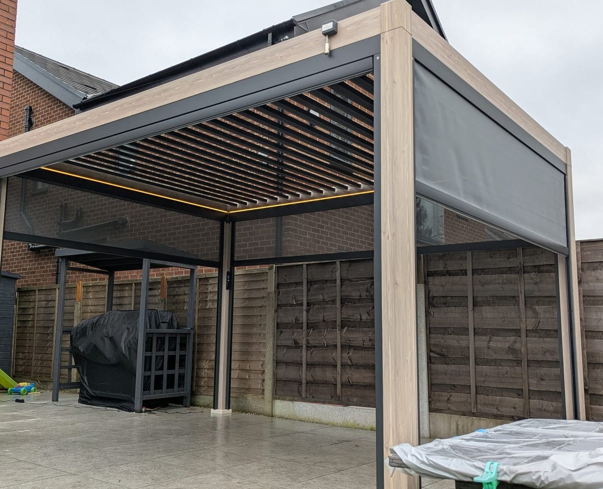 LuxShade™ 3×6m Aluminium Pergola LEDs, Double-Layered Louvred Roof & Blinds Oak Effect